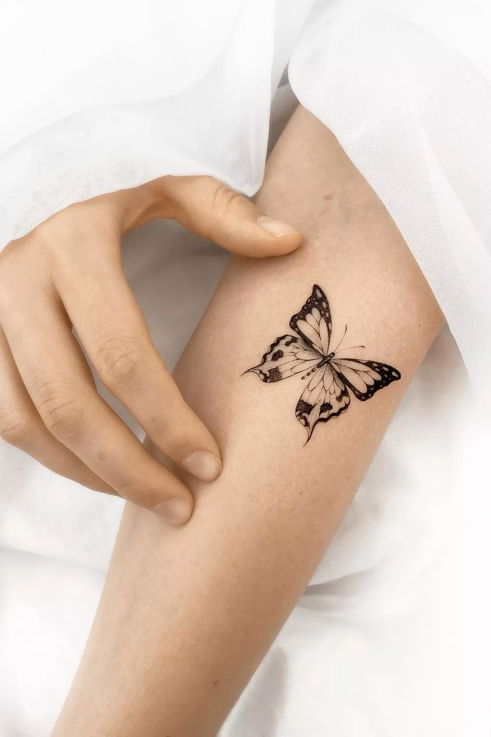 mariposa azul tatuaje